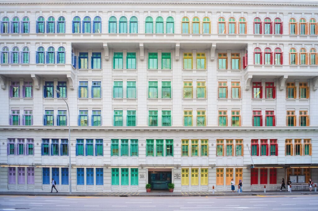 Vibrant facade of the Old Hill Street Police Station in Singapore. Iconic colorful windows.