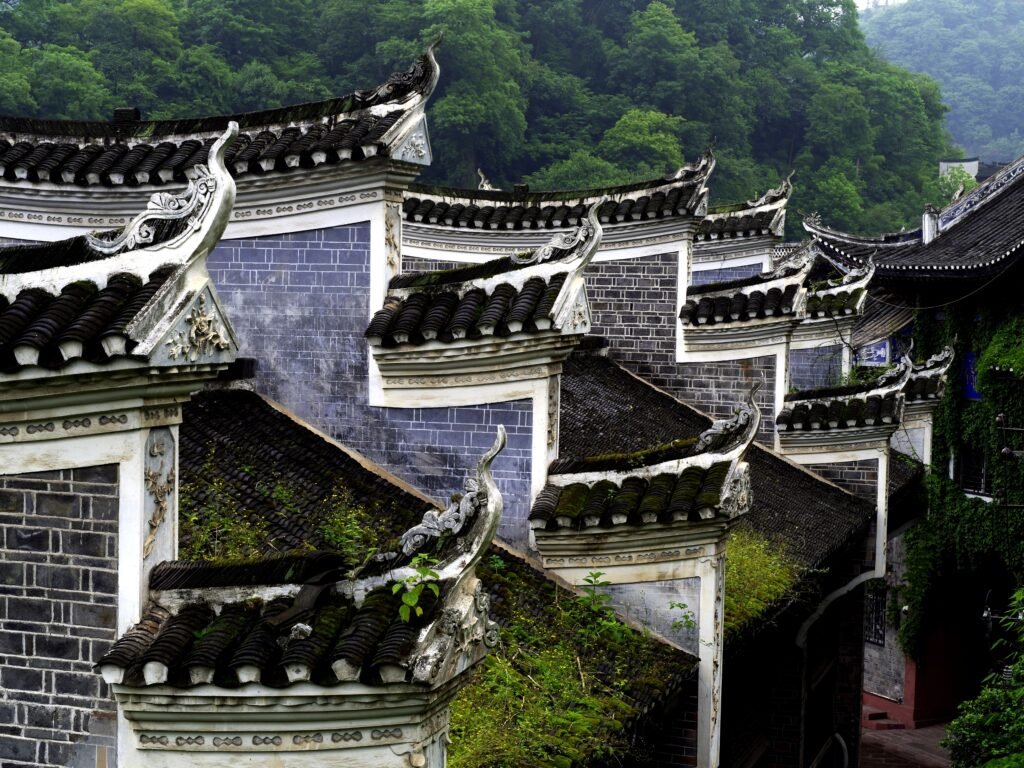 Detailed view of traditional dragon-roofed buildings in Fenghuang, China.